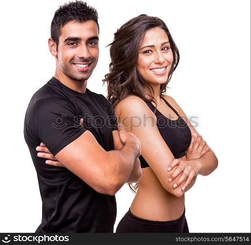 Fitness instructors posing over white background
