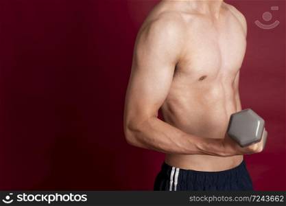 Fitness man on red background