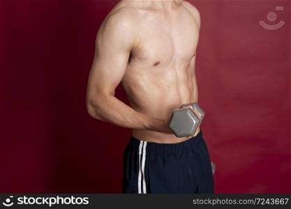 Fitness man on red background