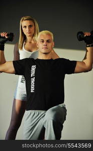 fitness personal trainer in fitness club exercise with client