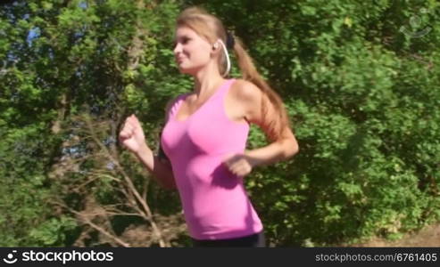 Fitness routine for women - athletic girl runner jogging along road