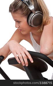 Fitness series - Woman with headphones exercising on white background