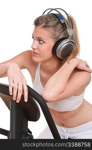 Fitness series - Woman with headphones exercising on white background