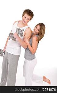 Fitness - Smiling healthy couple exercising with weights on white background