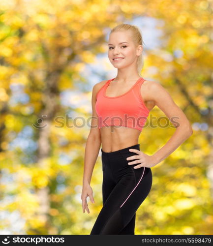 fitness, sport and diet concept - beautiful athletic woman in sportswear