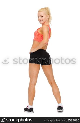 fitness, sport and diet concept - beautiful athletic woman in sportswear from the back