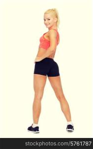 fitness, sport and diet concept - beautiful athletic woman in sportswear from the back