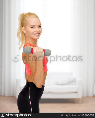 fitness, sport and diet concept - smiling beautiful sporty woman with dumbbell