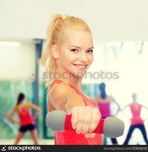 fitness, sport and diet concept - smiling beautiful sporty woman with dumbbell