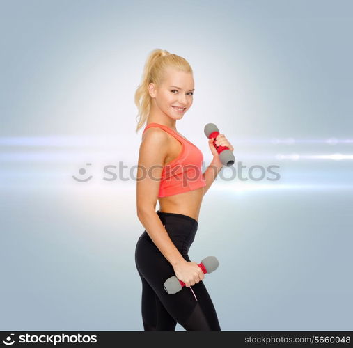 fitness, sport and diet concept - smiling beautiful sporty woman with dumbbells