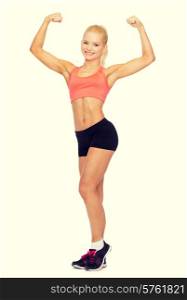 fitness, sport and diet concept - smiling sporty woman flexing her biceps