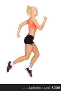 fitness, sport and dieting concept - beautiful sporty woman running or jumping