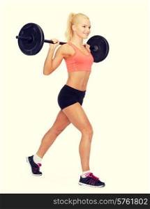 fitness, sport and exercise concept - smiling sporty woman with barbell doing split squat or lunge
