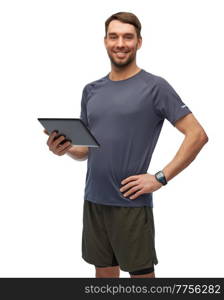 fitness, sport and healthy lifestyle concept - smiling man in sports clothes holding tablet pc computer over white background. smiling man in sports clothes holding tablet pc