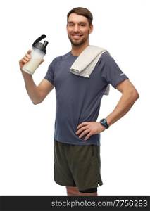 fitness, sport and healthy lifestyle concept - smiling man in sports clothes with protein shake bottle and towel over white background. happy man in sports clothes with bottle and towel