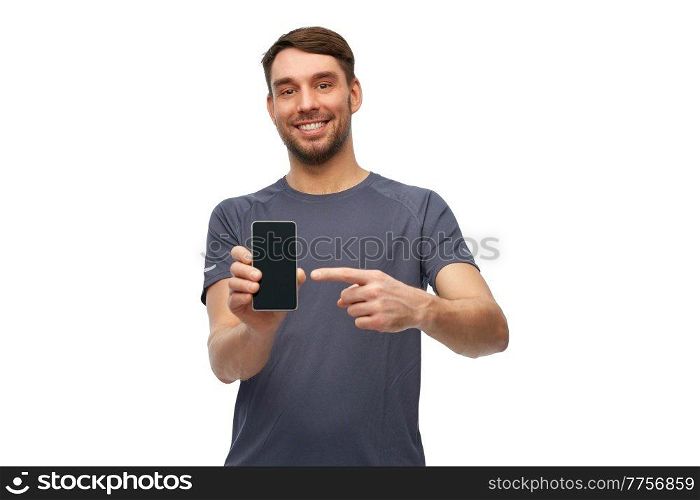 fitness, sport and healthy lifestyle concept - smiling man in sports clothes showing smartphone over white background. smiling man in sports clothes showing smartphone