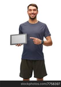 fitness, sport and healthy lifestyle concept - smiling man in sports clothes showing tablet pc computer over white background. smiling man in sports clothes showing tablet pc