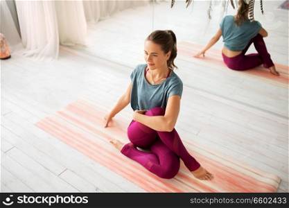 fitness, sport and healthy lifestyle concept - woman doing yoga exercise at studio. woman doing yoga exercise at studio