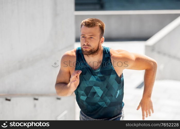 fitness, sport and healthy lifestyle concept - young man running upstairs. young man running upstairs