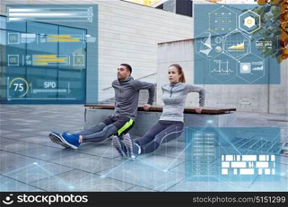 fitness, sport and people concept - couple doing triceps dip exercise on bench outdoors. sporty couple doing triceps dip exercise outdoors