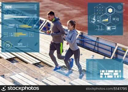 fitness, sport and people concept - couple running upstairs on stadium. sporty couple running upstairs on stadium