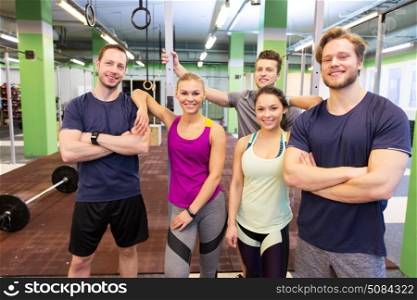 fitness, sport and people concept - group of happy friends in gym. group of happy friends in gym. group of happy friends in gym