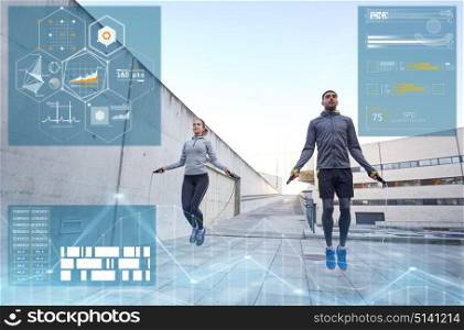 fitness, sport and people concept - man and woman skipping with jump rope outdoors. man and woman exercising with jump-rope outdoors