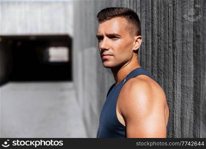 fitness, sport and people concept - portrait of young man outdoors. portrait of young man outdoors
