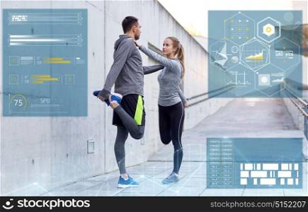 fitness, sport and people concept - smiling couple stretching leg outdoors. smiling couple stretching leg outdoors