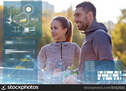 fitness, sport and people concept - smiling couple with bottles of water outdoors. smiling couple with bottles of water outdoors