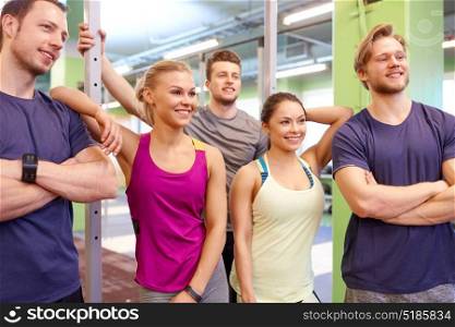 fitness, sport, exercising and healthy lifestyle concept - group of happy people in gym. group of happy friends in gym