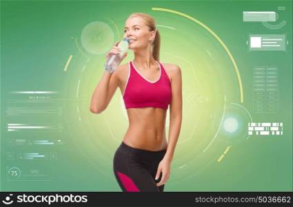 fitness, sport, exercising, slimming and people concept - happy sporty woman drinking water from bottle. happy sporty woman drinking water from bottle