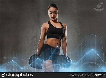 fitness, sport, exercising, training and people concept - young woman flexing muscles with dumbbells in gym. young woman flexing muscles with dumbbells in gym
