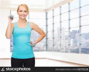 fitness, sport, fitness and people concept - smiling woman with light weight dumbbells flexing biceps over gym or home background