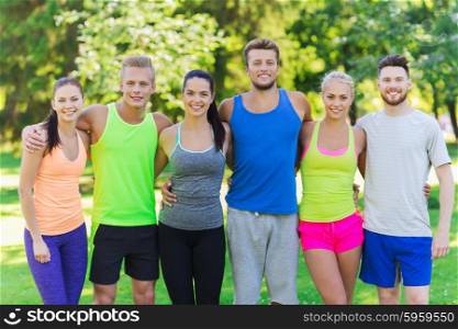 fitness, sport, friendship and healthy lifestyle concept - group of happy teenage friends or sportsmen outdoors