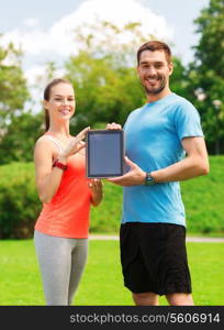 fitness, sport, friendship, technology and lifestyle concept - smiling couple with tablet pc computer outdoors