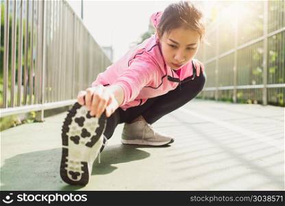 Fitness sport girl fashion sportswear doing yoga fitness exercis. Fitness sport girl fashion sportswear doing yoga fitness exercise in street. Fit young asian woman doing training workout in morning. Young happy asian woman stretching at park after running workout.