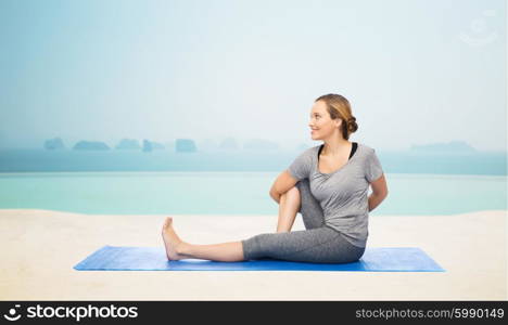 fitness, sport, people and healthy lifestyle concept - woman making yoga in twist pose on mat over infinity edge pool at hotel resort background