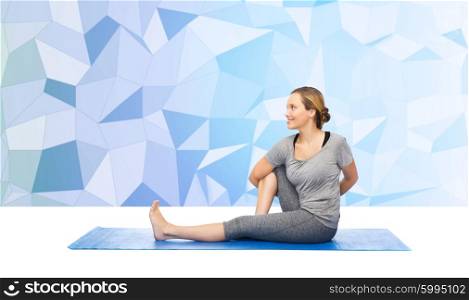 fitness, sport, people and healthy lifestyle concept - woman making yoga in twist pose on mat over blue polygonal background