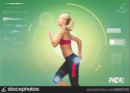 fitness, sport, people and technology concept - smiling young woman running over green background. smiling young woman running over green