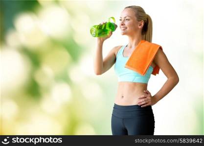 fitness, sport, training, drink and lifestyle concept - woman with bottle of water and towel over green natural background