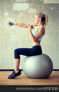 fitness, sport, training, future technology and lifestyle concept - smiling woman with dumbbells and exercise ball in gym and projection