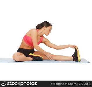 fitness, sport, training, gym and lifestyle concept - beautiful sporty woman doing exercise on the floor