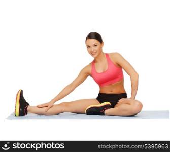 fitness, sport, training, gym and lifestyle concept - beautiful sporty woman doing exercise on the floor