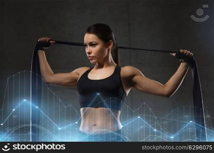 fitness, sport, training, people and lifestyle concept - woman doing exercises with expander or resistance band in gym. woman with expander exercising in gym