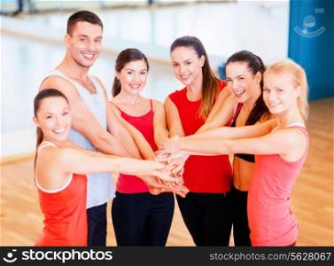 fitness, sport, training, success and lifestyle concept - group of happy people in the gym celebrating victory