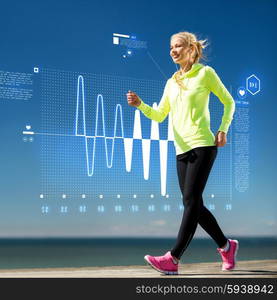 fitness, sport, training, technology and lifestyle concept - woman doing sports outdoors with earphones