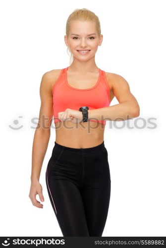 fitness, technology and exercising concept - smiling woman with heart rate monitor on hand