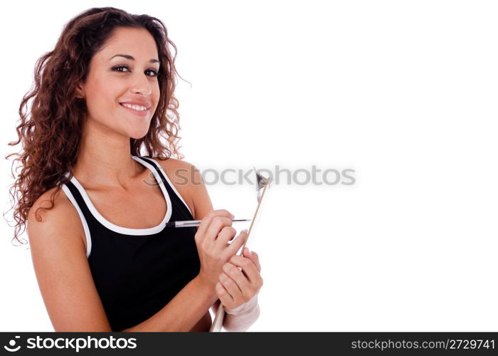 Fitness Trainer marking in a clip board on a white background
