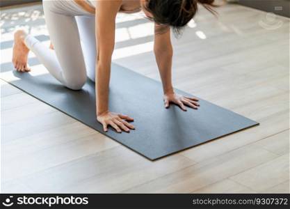 Fitness training woman standing at yoga class. standing on yoga mat in fitness studio